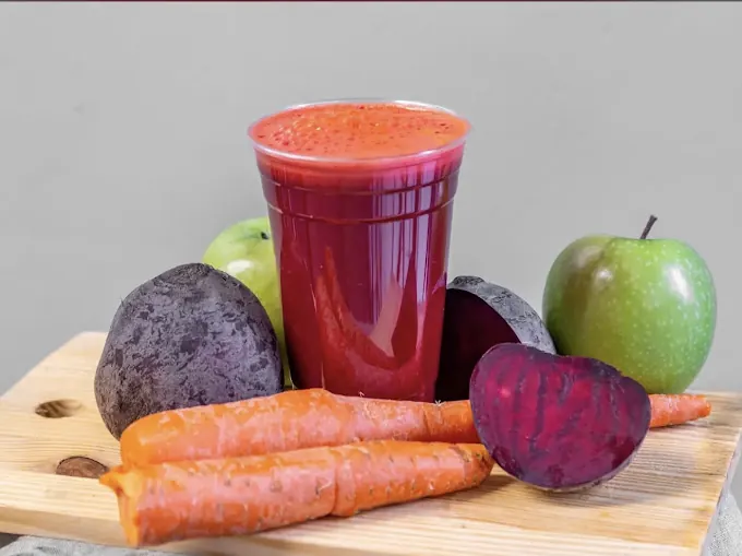 Fresh beet juice with carrots, beets and green apples