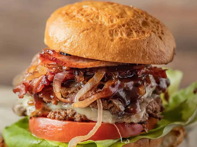 Smash burger with melted cheese and caramelized onions