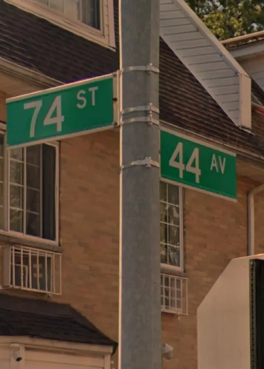 Street signs at 74th Street and 44th Avenue in Queens, New York